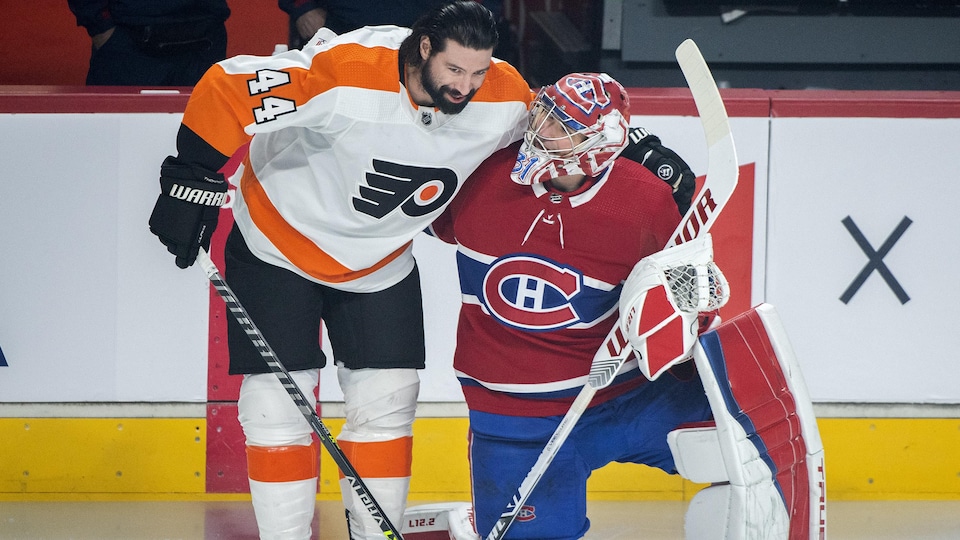 Nate Thompson hugs Carey Price.