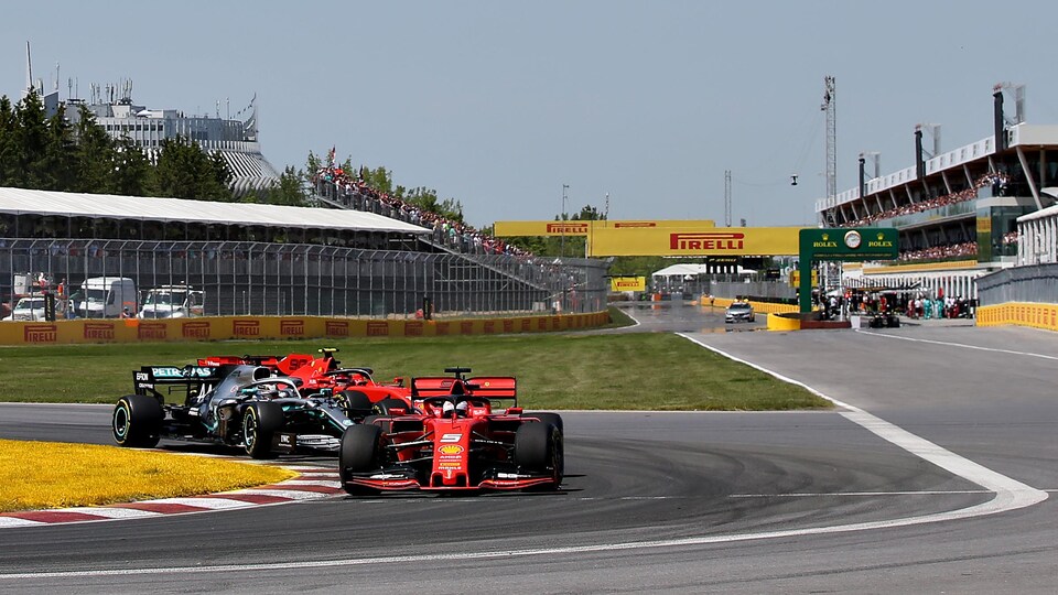 Sebastian Vettel, in his red Ferrari, is leading the field at the start of the 2019 Canadian Grand Prix.