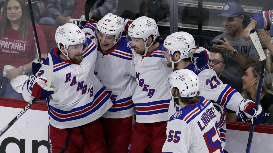 He received a hug from his teammates along the ramp after scoring a goal.