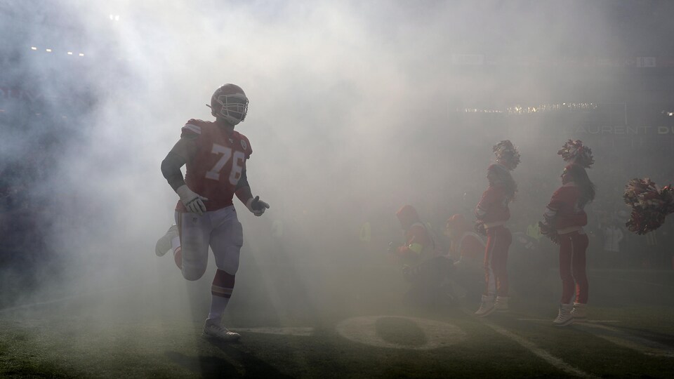 A player enters the field through the smoke screen