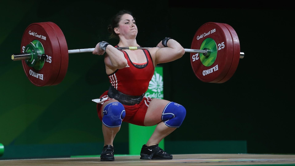 Maude Charron raises the bar during a competition.