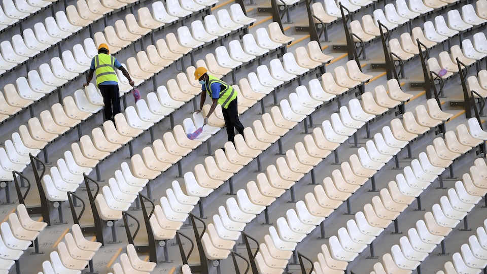 Two workers are clearing banks.