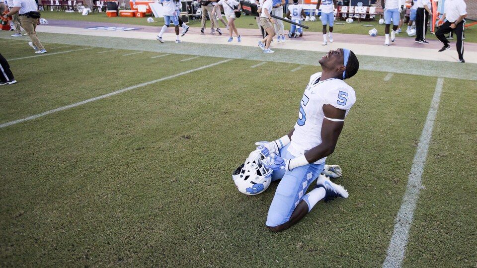 Patrice René celebrates an important victory by looking up at the sky.