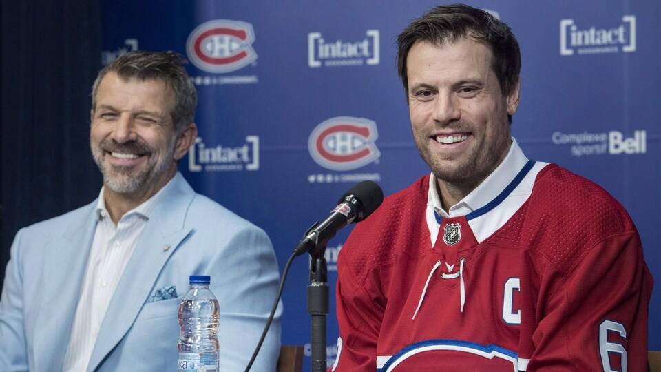 At a press conference, the two men smiled. Weber wore the C for captain on his jersey.