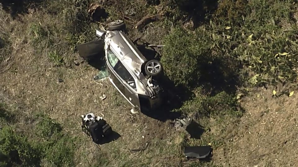 Footage from KABC-TV shows Tiger Woods ’car overturning on the road.