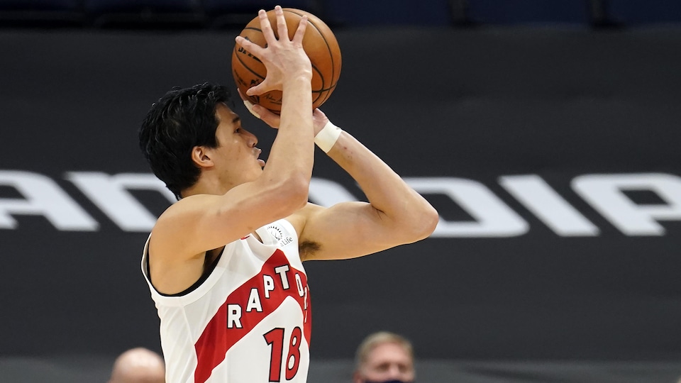 Yuta Watanabe of the Raptors takes a shot during an NBA game.