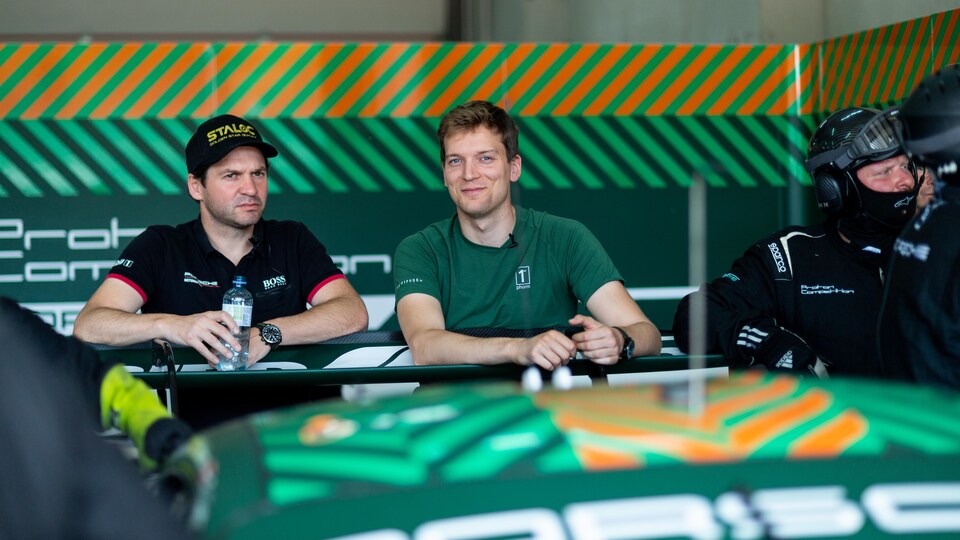 A man smiles at the camera. 