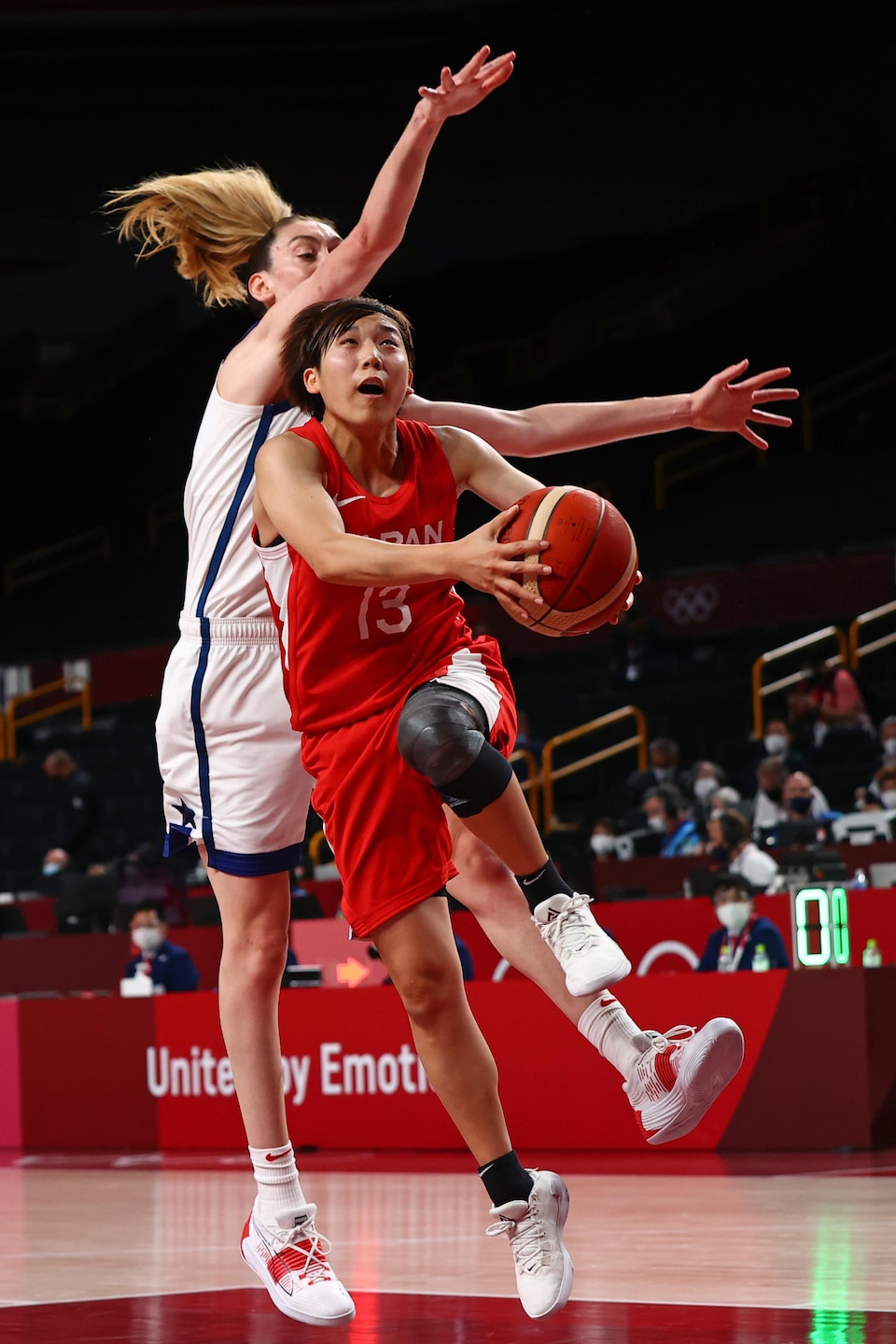 He tried to throw the ball, but behind him was a tall defender. 