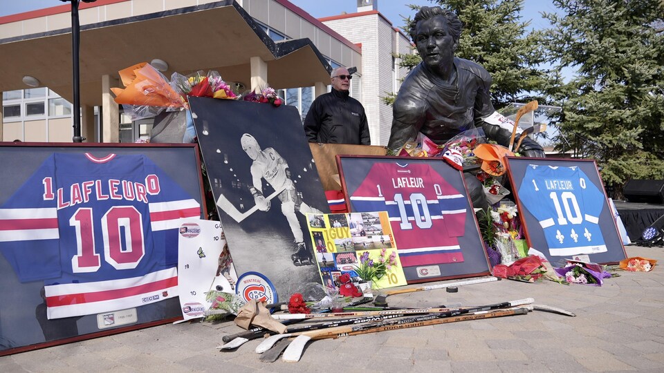 Guy Lafleur’s sweaters are framed at the foot of his statue