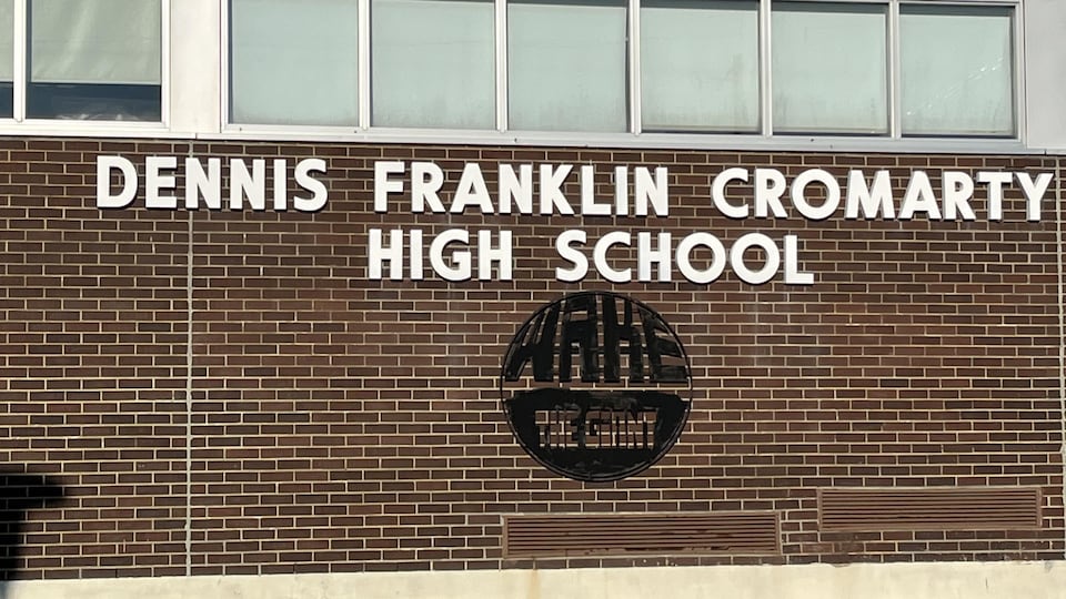 Wake the Giant's logo under the school name Dennis Franklin Cromarty 