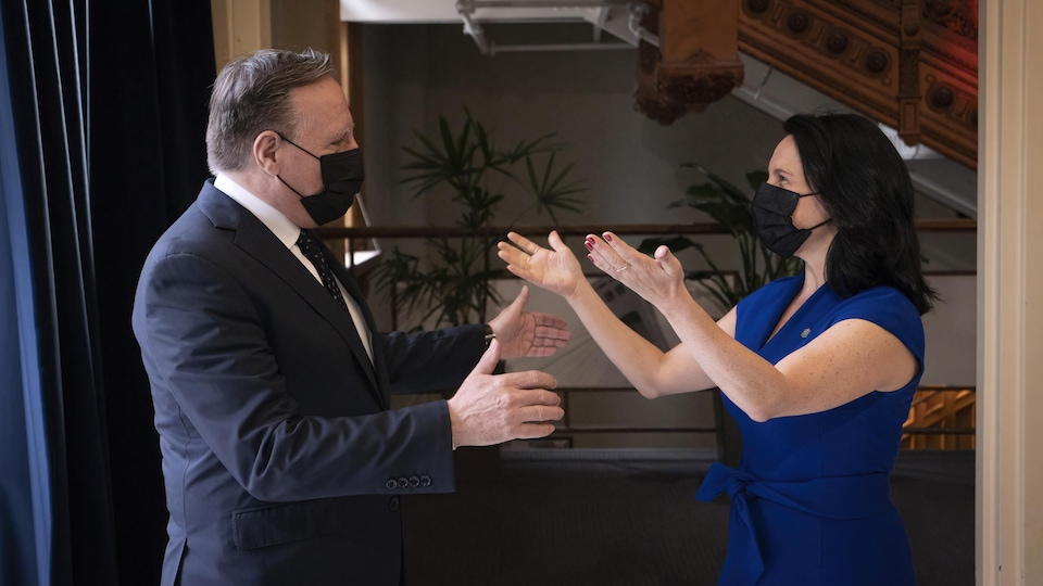 François Legault and Valérie Plante greet each other.