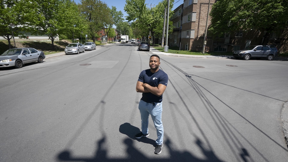 Wadley Angibeau proudly stands in the middle of the street.
