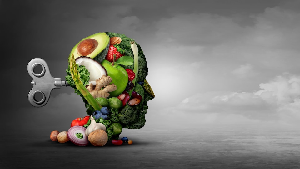 Illustration d'une tête faite avec divers légumes et fruits avec à l'arrière de la tête une clé qu'il est possible de remonter pour donner de l'énergie.