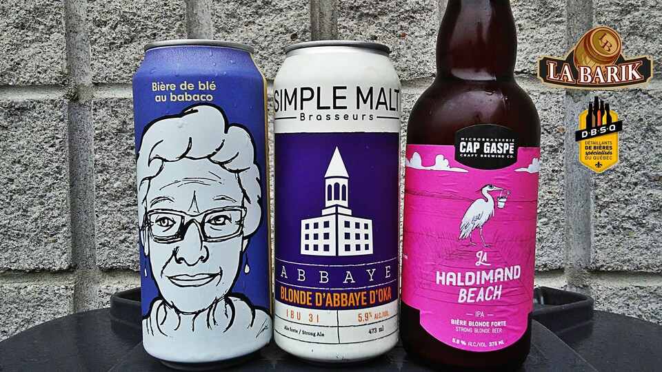 Trois canettes de bières.