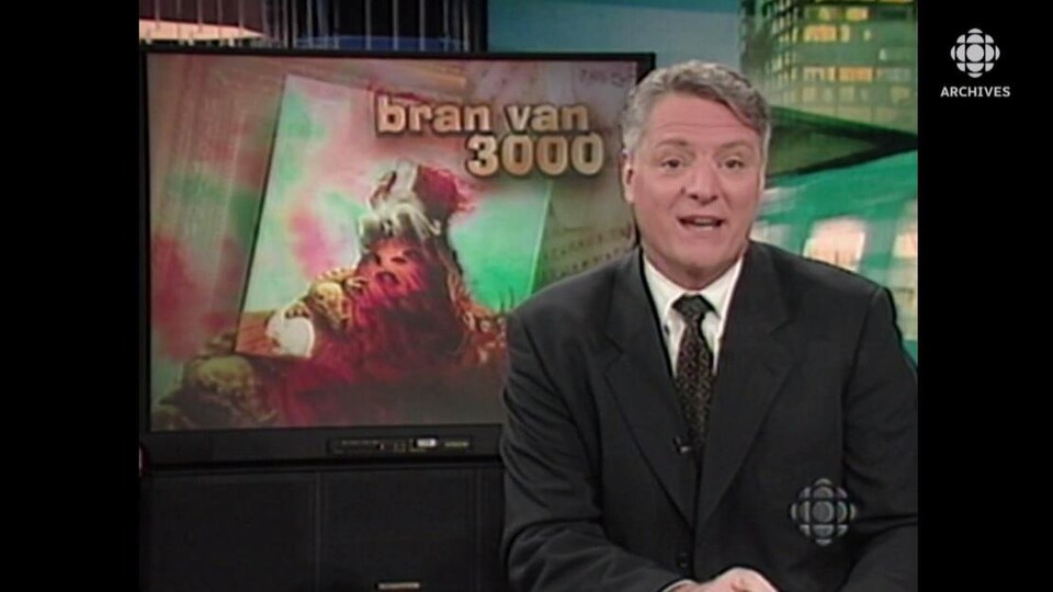 Derrière l'animateur du « Montréal ce soir » Pierre Craig se trouve un écran sur lequel est écrit « Bran Van 3000 ». 