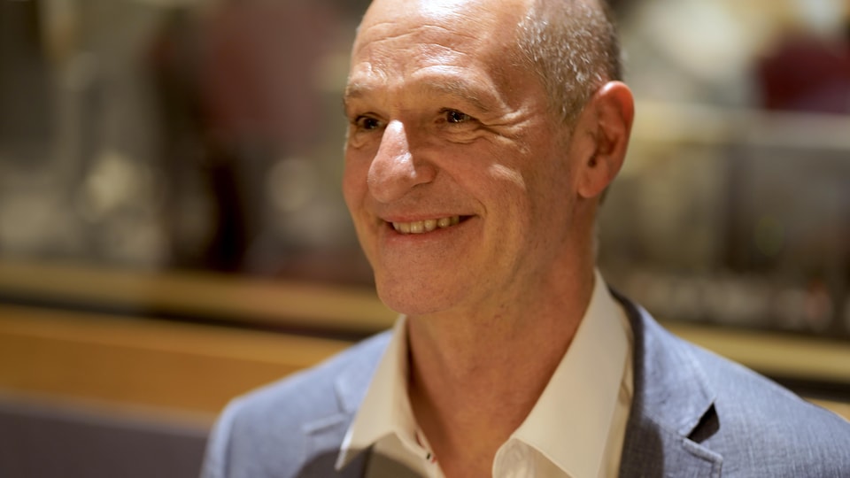 Roger La Rue smiles in his interview with Francis Reddy.              