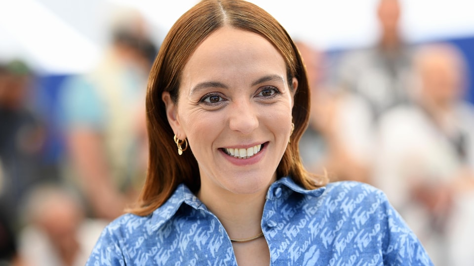 Photo of her smiling during a photo shoot.