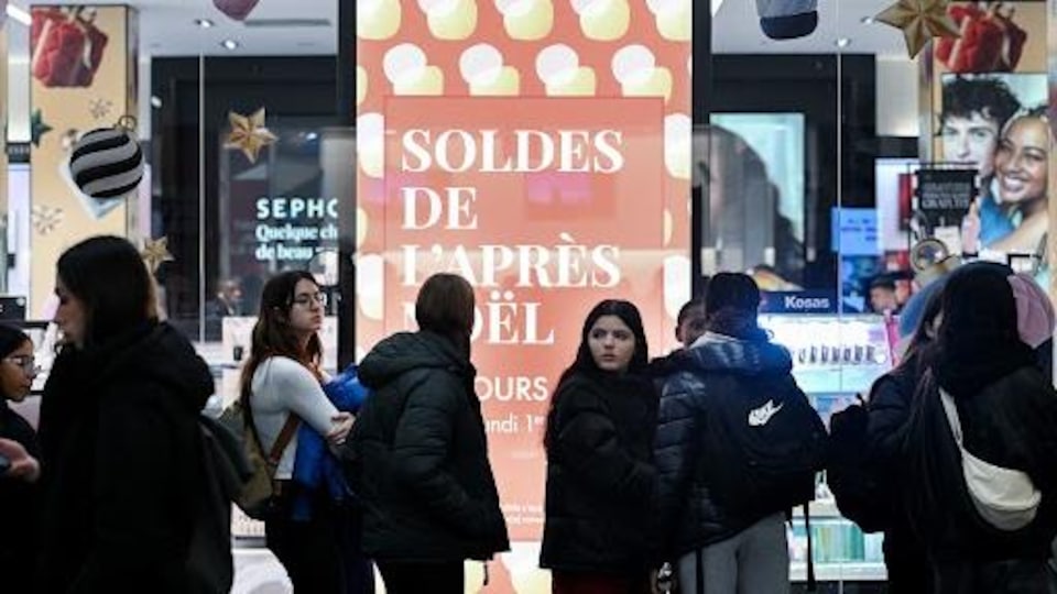 People wait in line outside a Sephora store on Boxing Day in Montreal, Tuesday, December 26, 2023.  THE CANADIAN PRESS/Graham Hughes