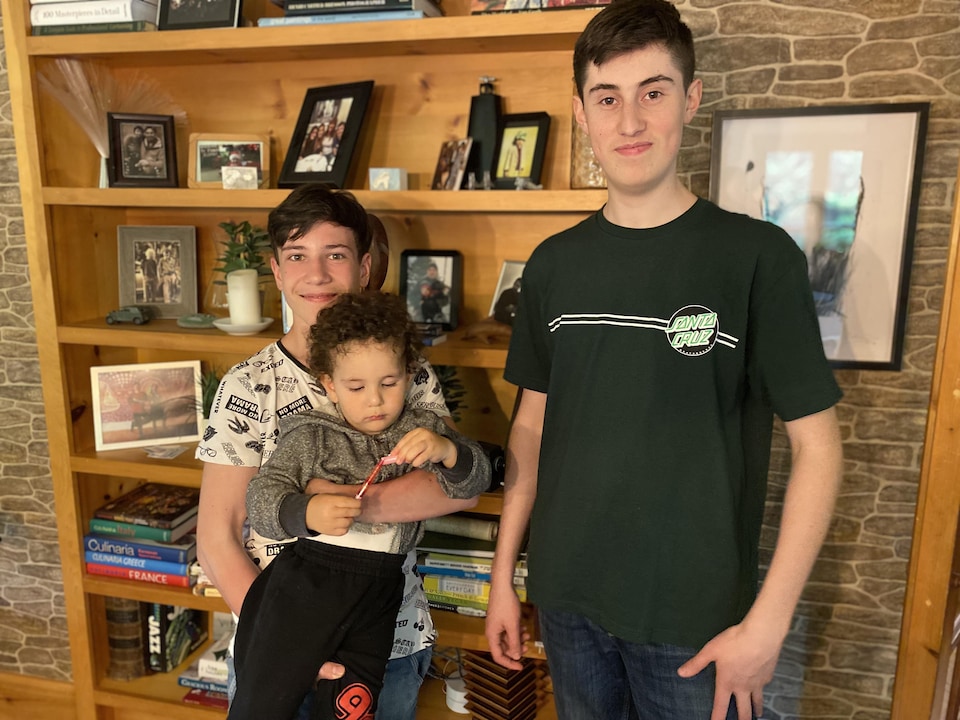 The three men in the house. 