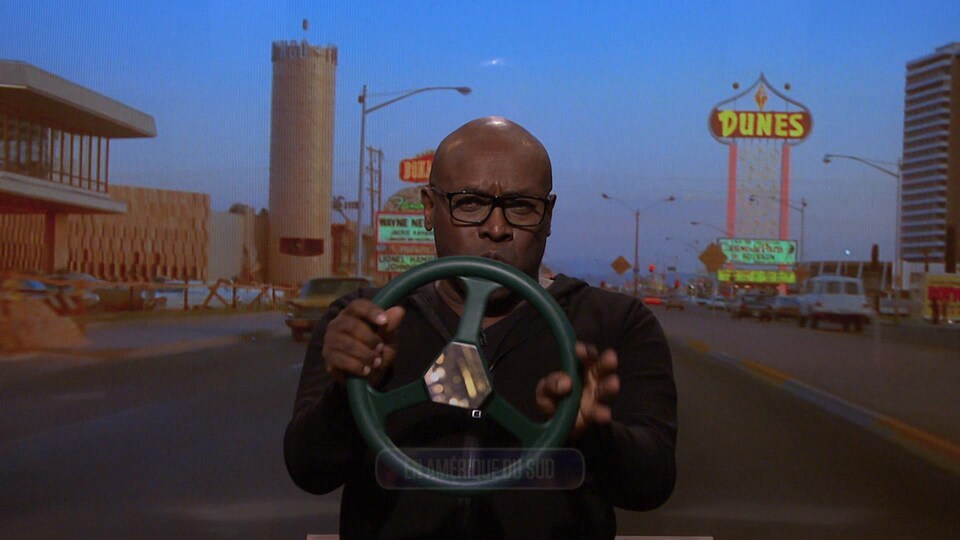 He was holding a fake steering wheel and pretending to drive.