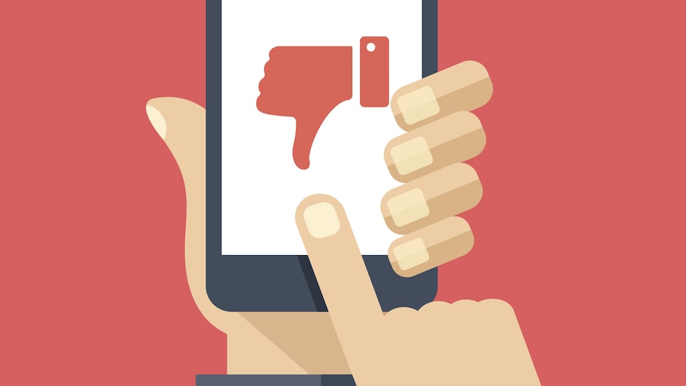Une illustration présente un téléphone portable sur l'écran duquel on voit un pouce tourné vers le bas.