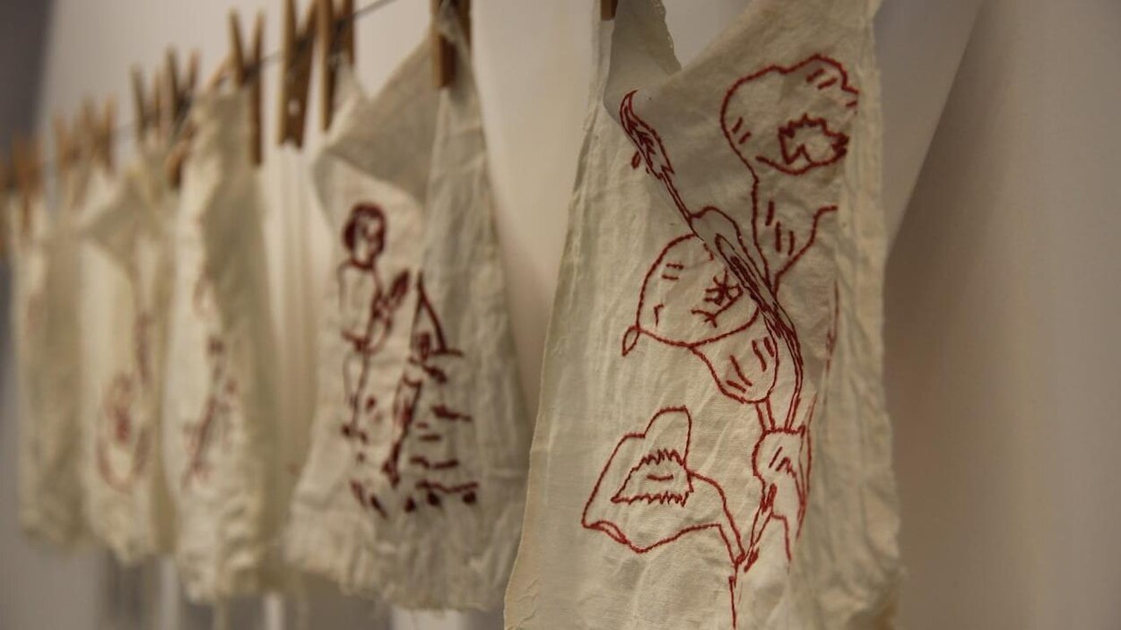 New redwork installation stitches provoking stories of war and ...