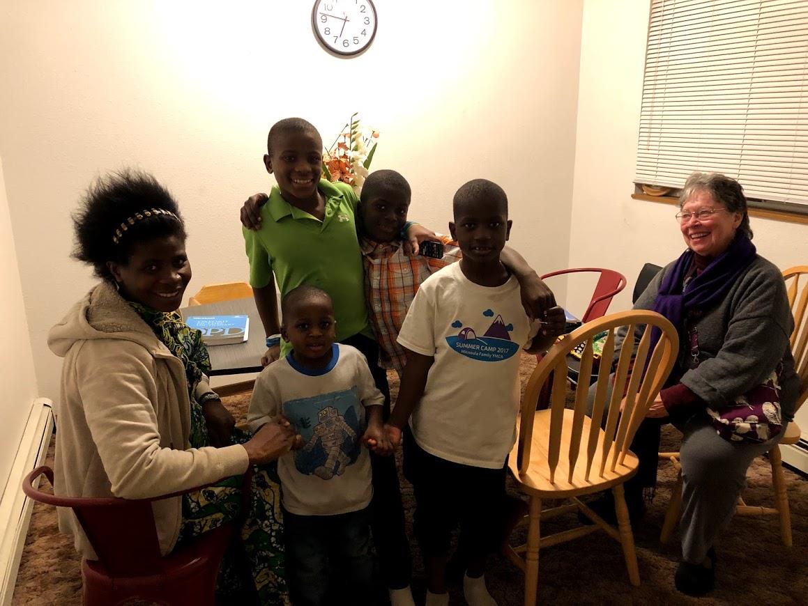 Kristin Freeman, right, with Chantal Nyiramanza and her four boys