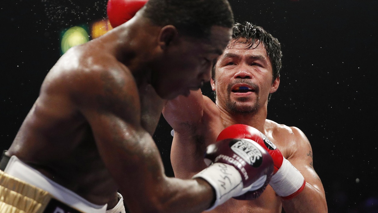  Manny  Pacquiao  conserve son titre des mi moyens de la WBA  