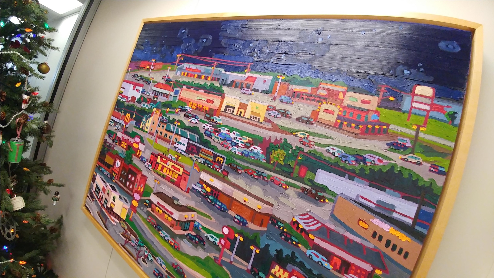 Un tableau d'une toile colorée qui affiche un quartier commercial d'une ville. Un tableau d'une toile colorée qui affiche un quartier commercial d'une ville.