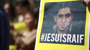 Une pancarte avec la photo de Raif Badawi et la mention « Je suis Raif ». 