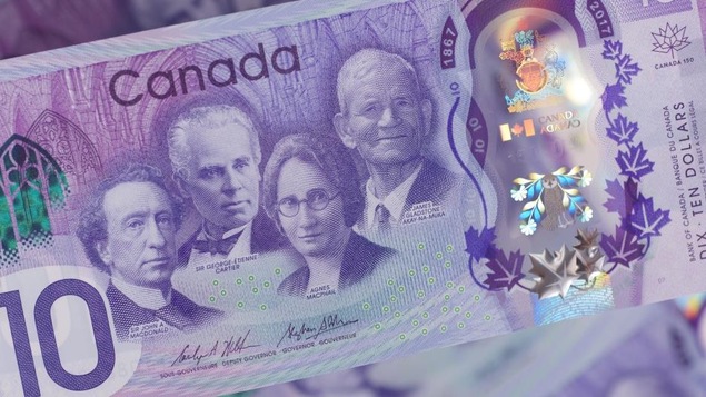 Un gros plan du côté face du nouveau billet commémoratif de 10 $. Un gros plan du côté face du nouveau billet commémoratif de 10 $.