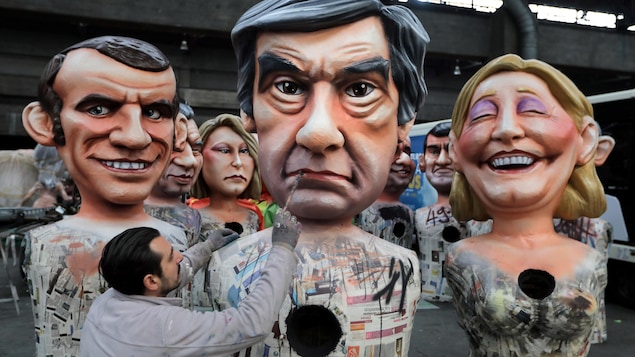 Des figures géantes des candidats présidentiels français lors du Carnaval de Nice de 2017