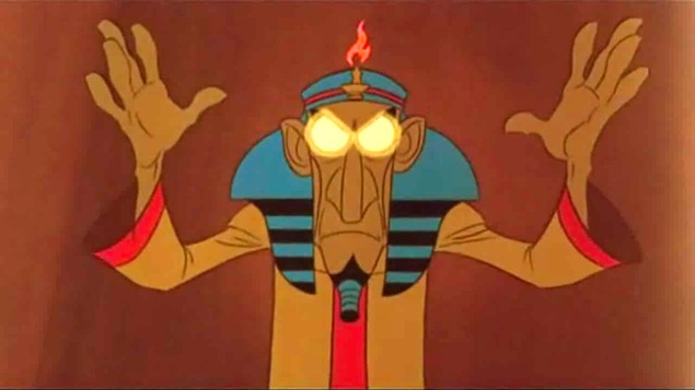 Capture d'écran d'un film d'animation pour enfant présentant un hypnotiseur les mains levées et les yeux ronds et blancs.