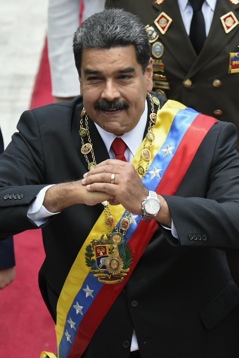 Nicolas Maduro et sa femme Cilia Flores arrivent au Congrès pour la cérémonie d'investiture le 24 mai 2018, à Caracas.