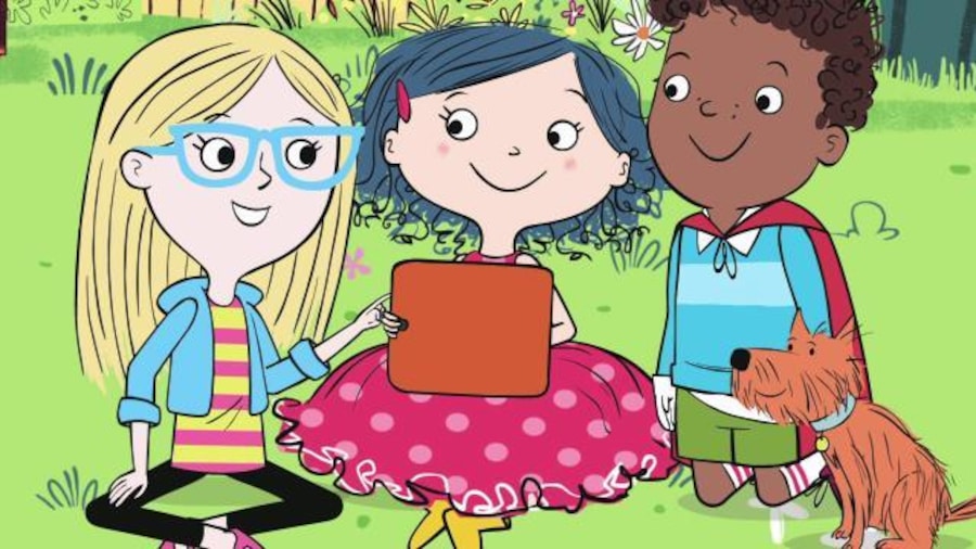 Ils sont assis dans l'herbe et jouent avec une tablette Ils sont assis dans l'herbe et jouent avec une tablette