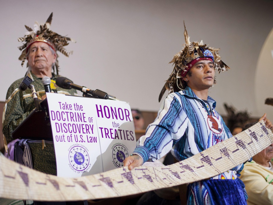 John Parsons, aka Tyhogeñhs, right, holds a historic wampum belt, that was commissioned by President George Washington ratifying the 1794 Treaty of Canandaigua, as Oren Lyons, left, Faitherkeeper, Turtle Clan, Onondaga Nation, answers question during a news conference in Washington, Tuesday, April 15, 2014. Onondaga Nation announced they will file a petition against the US with the Inter-American Commission on Human Rights (IACHR), claiming since 1788, 2.5 million acres of land have been stolen John Parsons, aka Tyhogeñhs, right, holds a historic wampum belt, that was commissioned by President George Washington ratifying the 1794 Treaty of Canandaigua, as Oren Lyons, left, Faitherkeeper, Turtle Clan, Onondaga Nation, answers question during a news conference in Washington, Tuesday, April 15, 2014. Onondaga Nation announced they will file a petition against the US with the Inter-American Commission on Human Rights (IACHR), claiming since 1788, 2.5 million acres of land have been stolen
